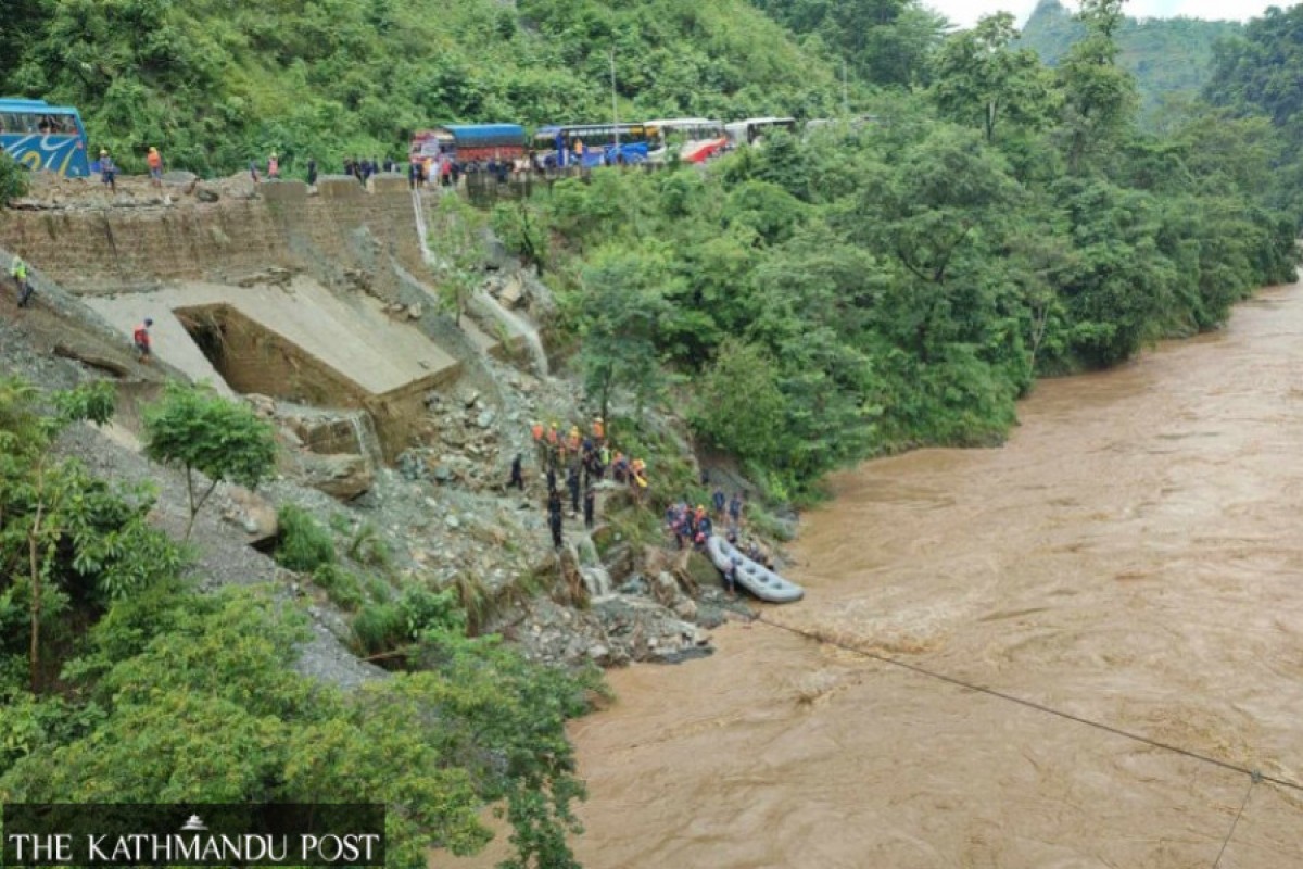 Nepal landslides sweep two buses into a river, 65 passengers missing