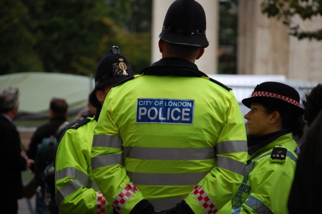 Police and protesters scuffle at anti-migrant London protest