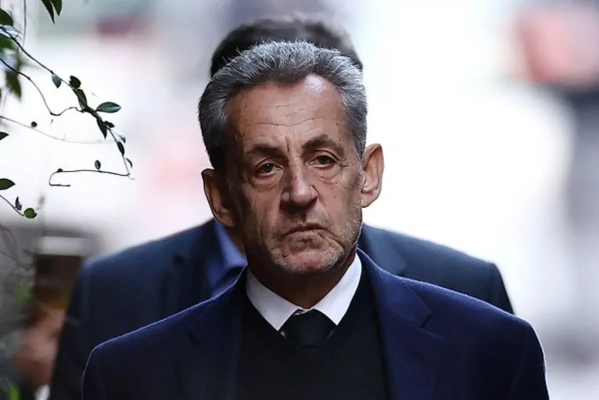 Former French president endures hostile prison welcome
