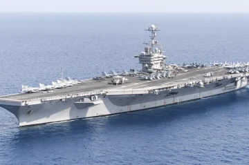 Spokesman: Yemen's Houthi rebels strike US aircraft carrier with missiles, drones