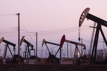 Oil prices tumble to four-year low as US-China trade war fuels recession fears