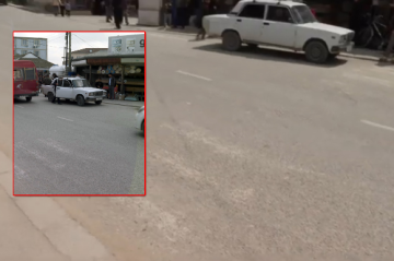 Məktəbin qarşısında piyada zolağı silinib, təhlükəli vəziyyət yaranıb -