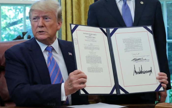Trump signs tax and spending bill into law