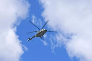 Kyrgyz emergency chief performs helicopter jump during drills photo
