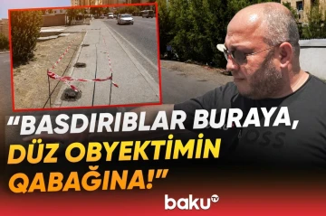 В Баку недовольные граждане демонтировали незаконные конструкции на тротуаре - ВИДЕО