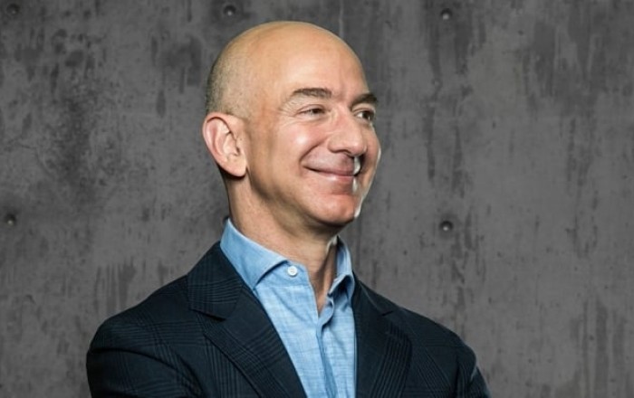 Bezos-backed consortium buys a third of Liverpool