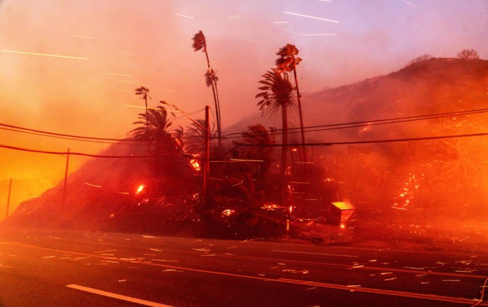 Los Angeles wildfires rage as strong winds put millions on alert